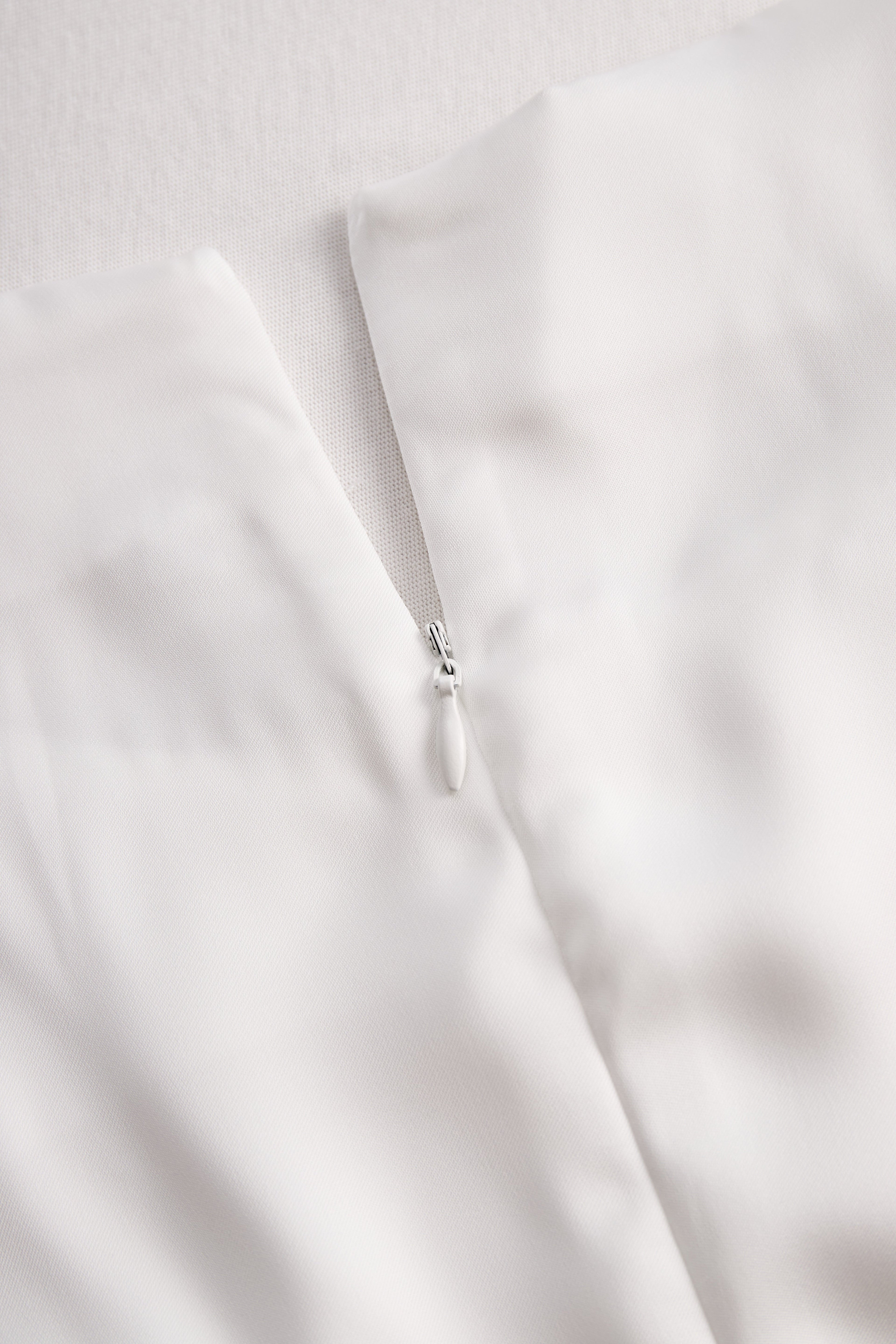 Elegant White Draped Top with Button Detail